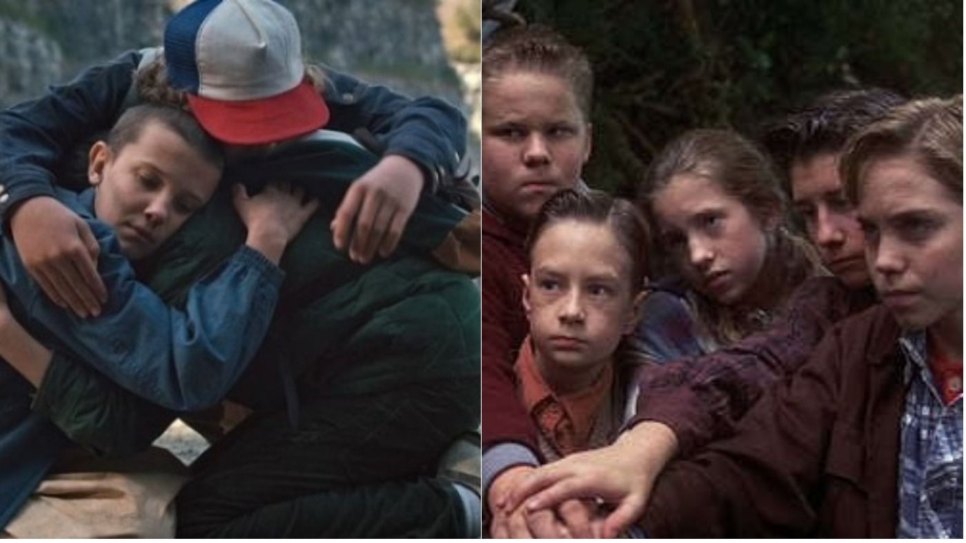 dustin eleven and mike hugging stranger things netflix the losers club 1990 it making a pact