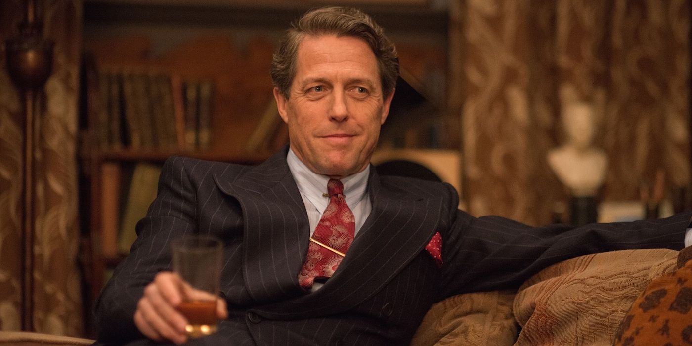Hugh Grant holding a drink in Florence Foster Jenkins