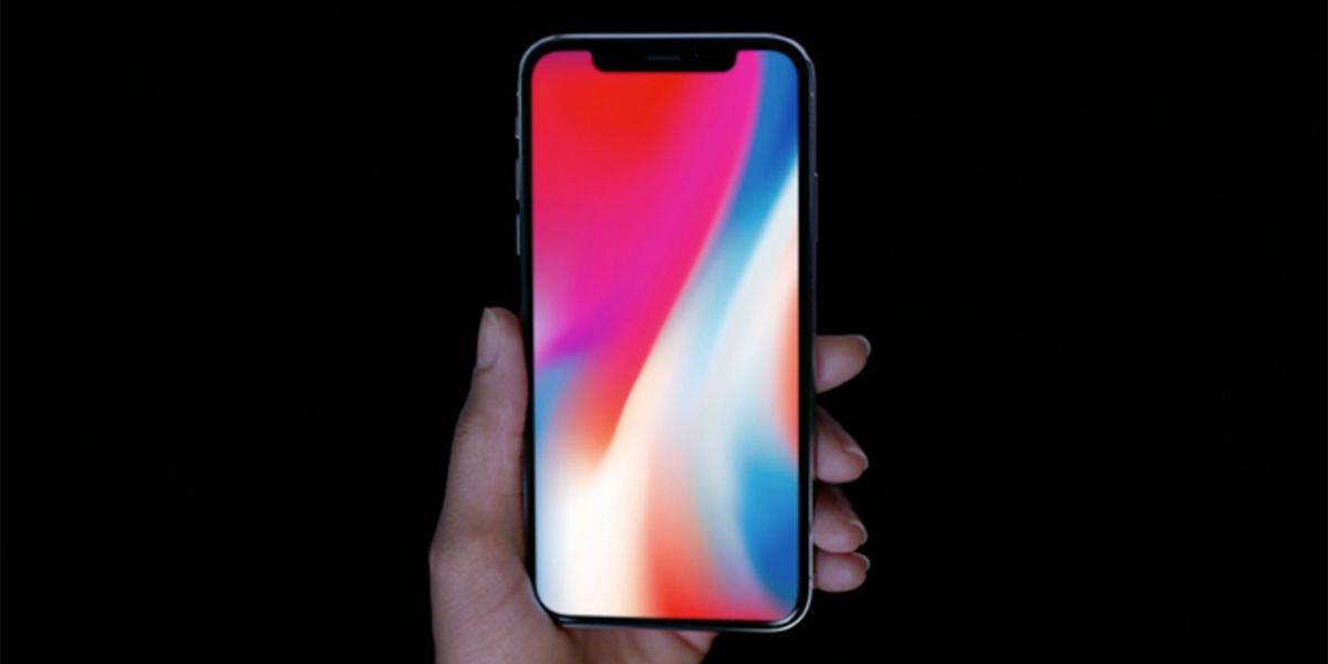 iPhone X in hand