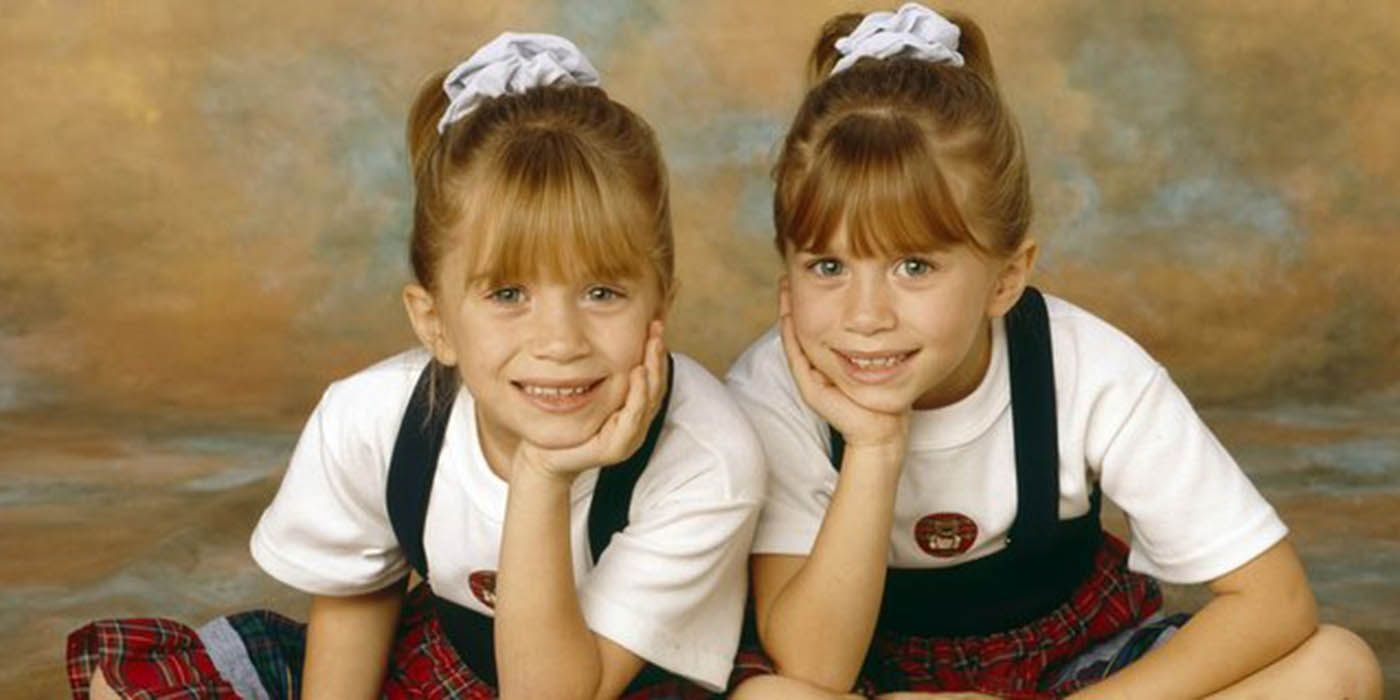 The Olsen Twins posing for a photo.