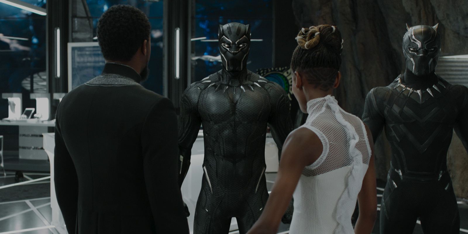 Shuri and T'Challa look at the Black Panther Suit