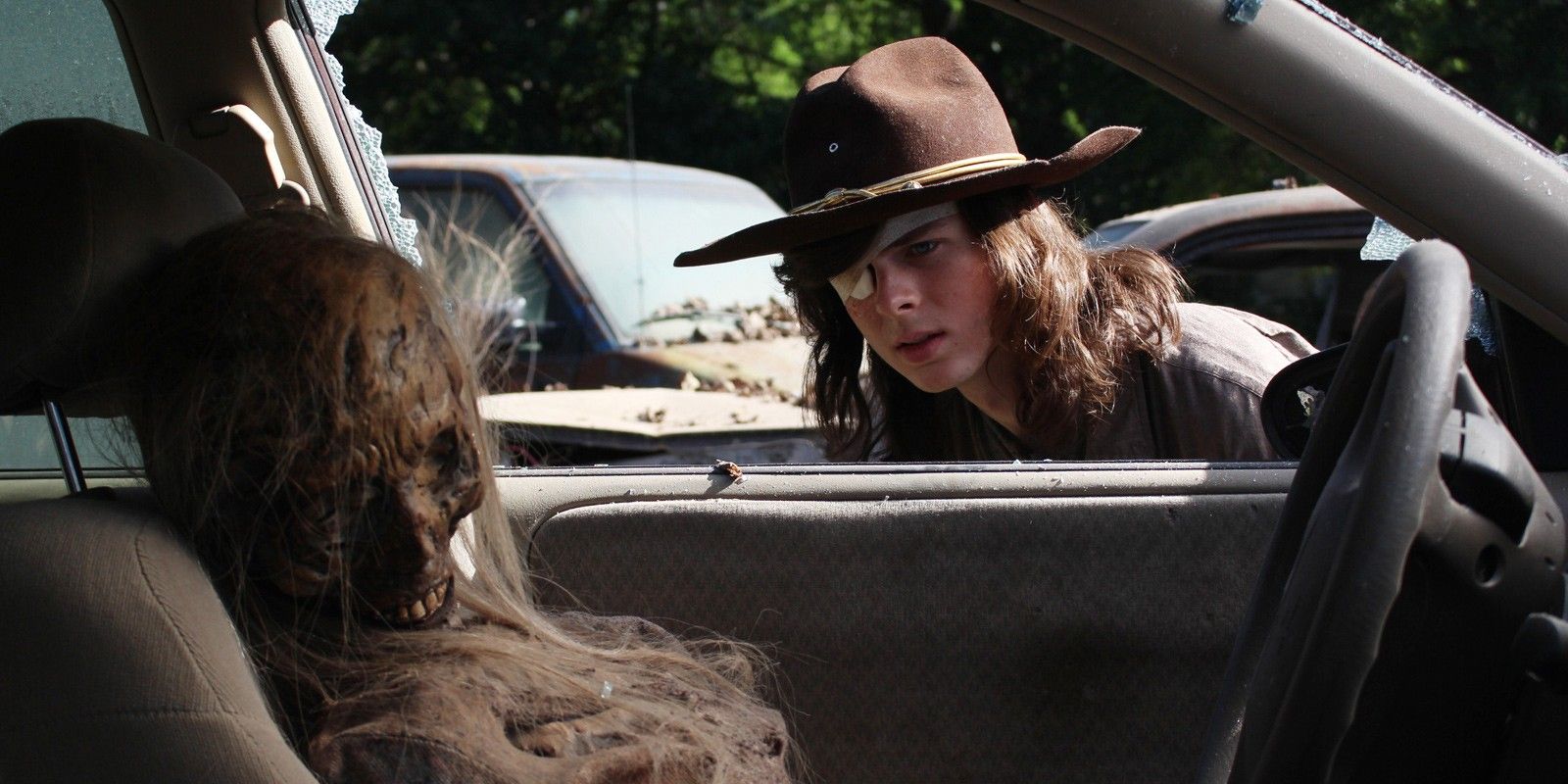 Chandler Riggs as Carl Grimes in The Walking Dead and zombie