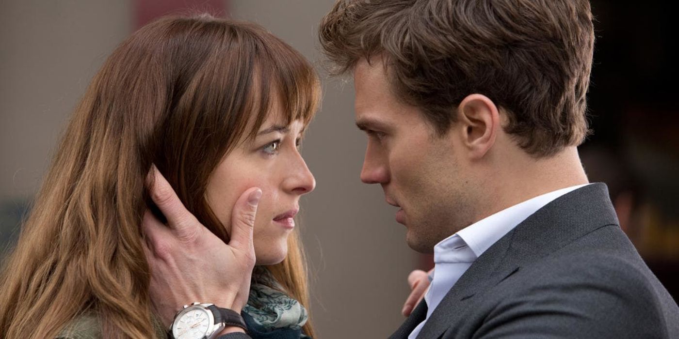 Christian holds Anna's face in Fifty Shades of Grey