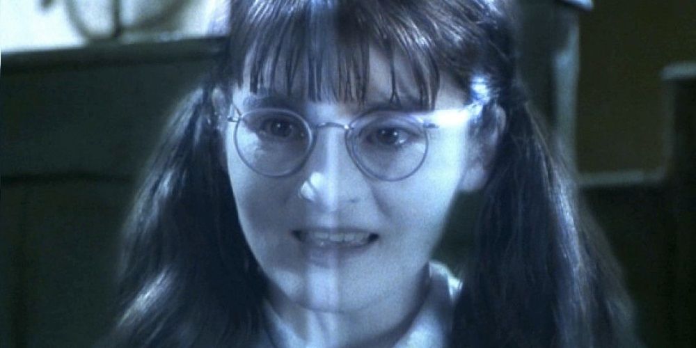 Moaning Myrtle in Harry Potter smiles mischieviously.
