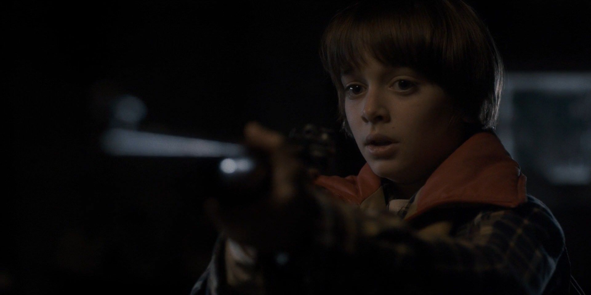 Noah Schnapp as Will Byers with shotgun in Stranger Things