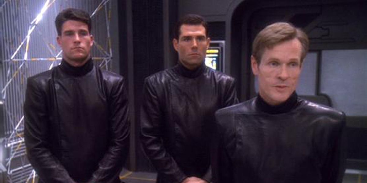 Several Section 31 Operatives look on from Deep Space Nine 
