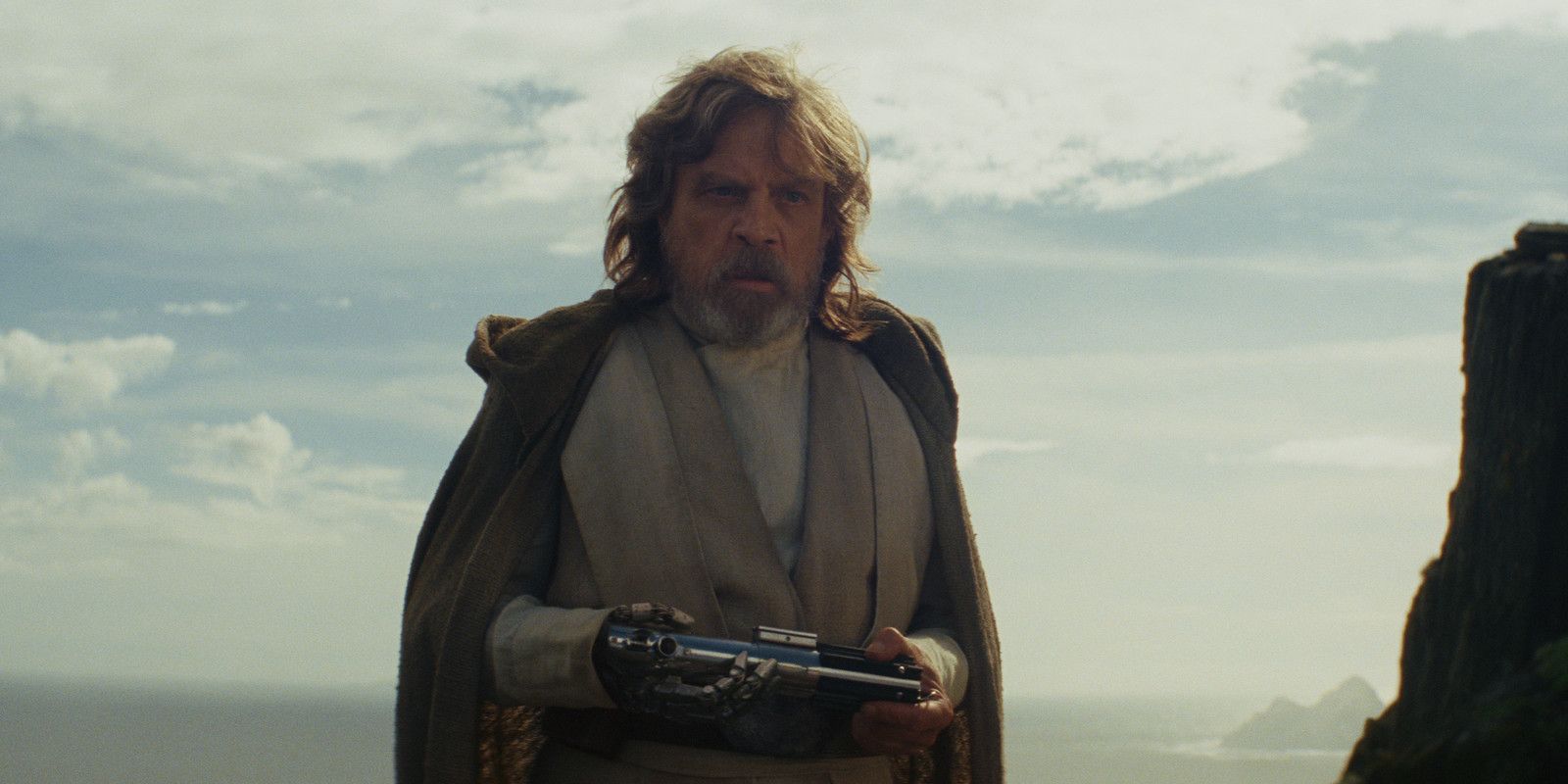 Luke Skywalker holding his old light saber