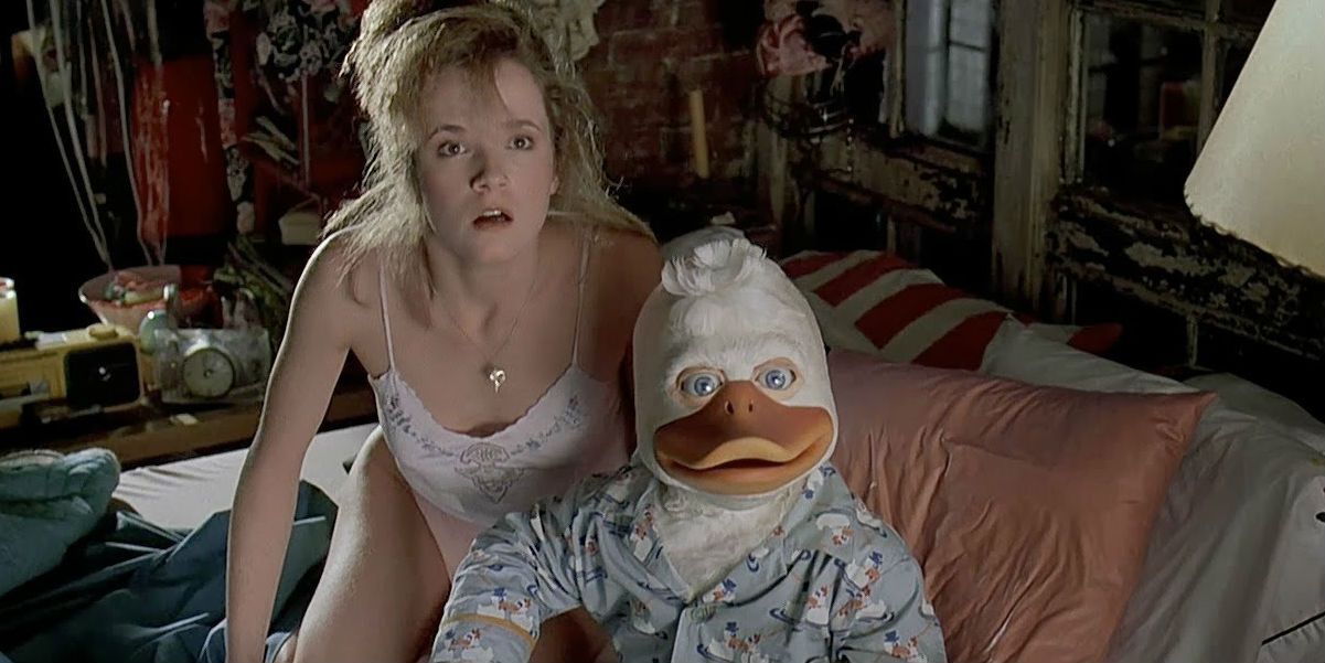 Howard the Duck and Lea Thompson in bed