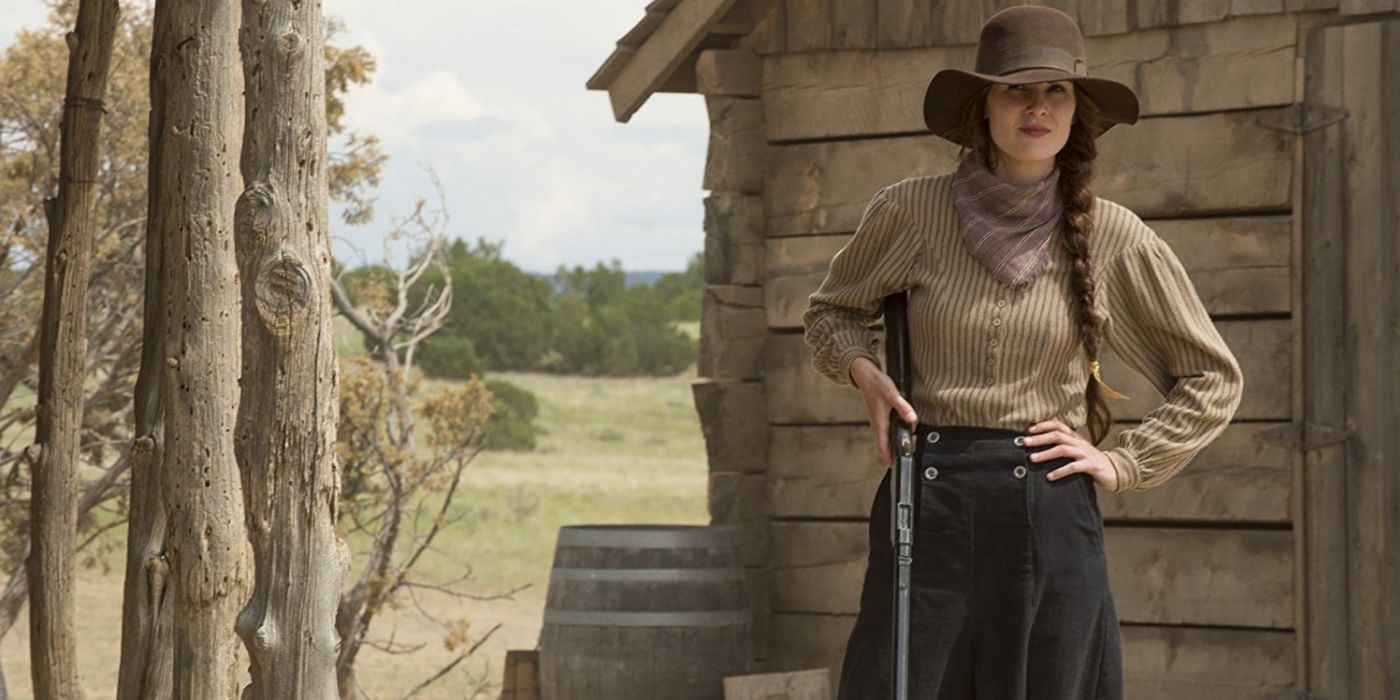 Michelle Dockery holding a rifle in Godless