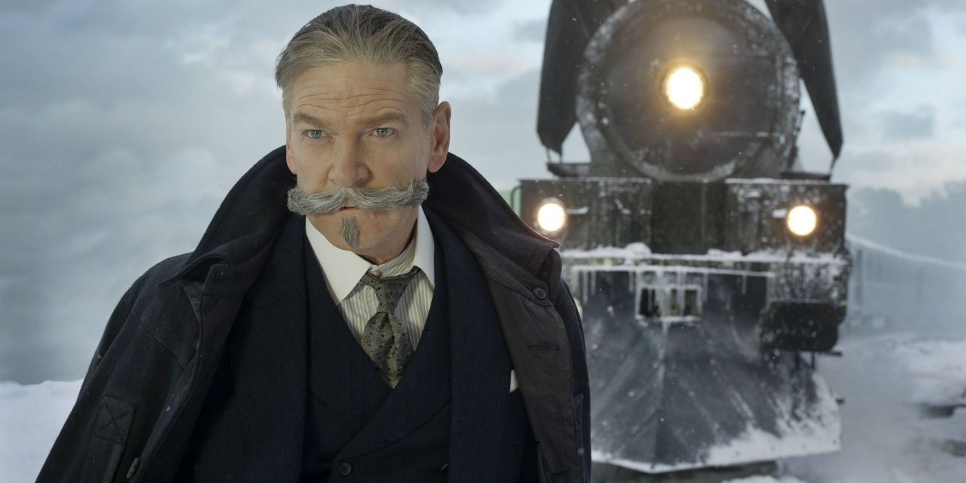 Hercule Poirot standing in front on the train in Murder on the Orient Express