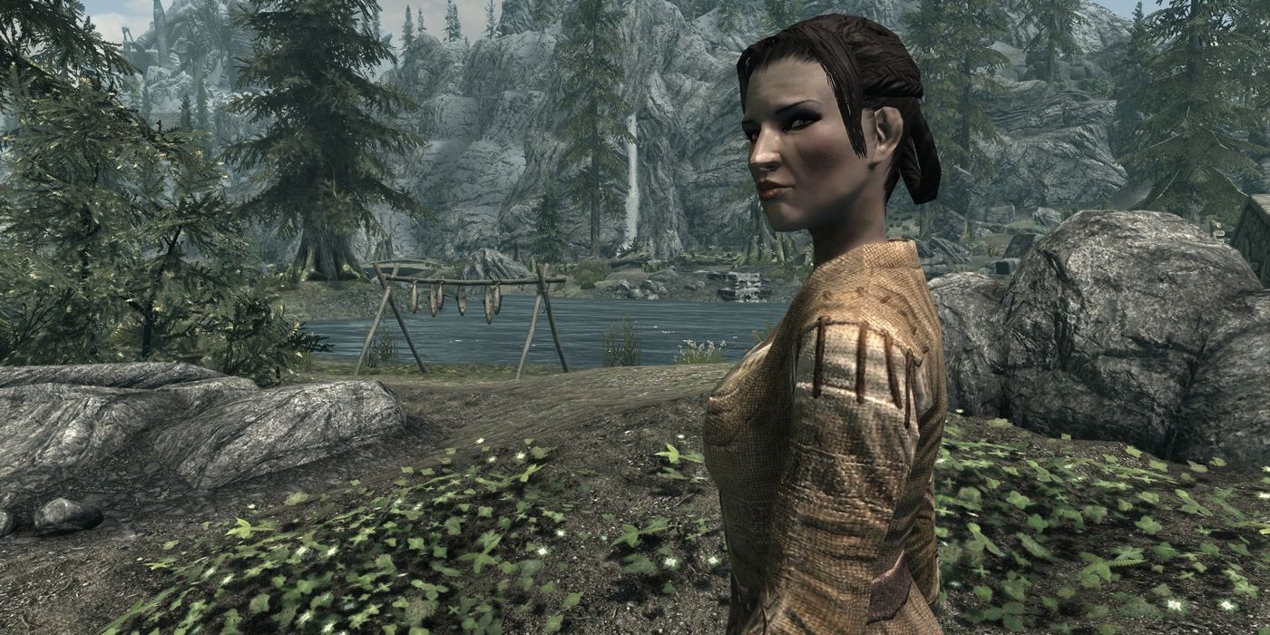 An image of Camilla Valerius looking back at the camera while standing outside of Riverwood in Skyrim.