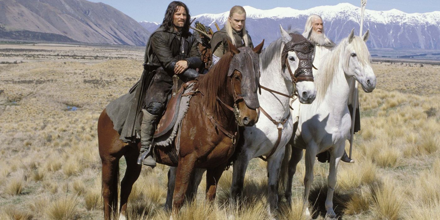 Gandalf, Aragon, and Legolas on horses in The Lord of the Rings