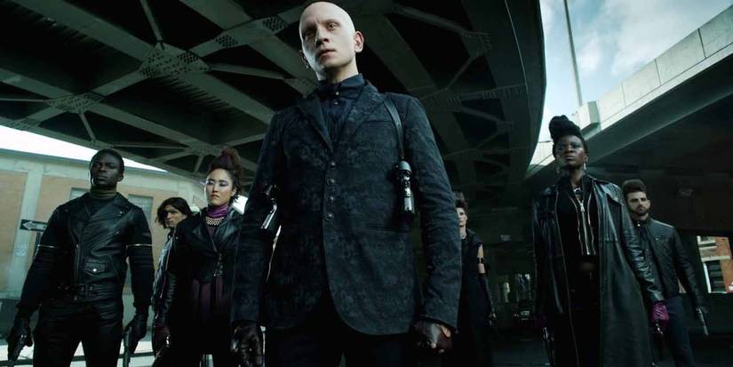 Victor Zsasz (Anthony Carrigan) in a full black suit in Gotham
