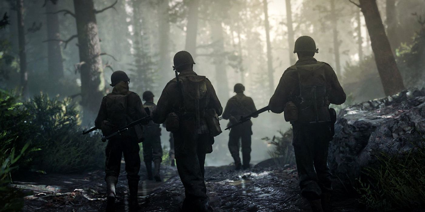 Soldiers march in a foggy forest in Call of Duty WW2 
