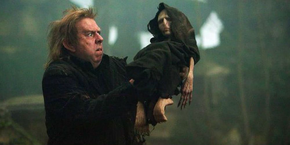 Wormtail holding up the infantile version of Voldemort in Harry Potter and the Goblet of Fire. 