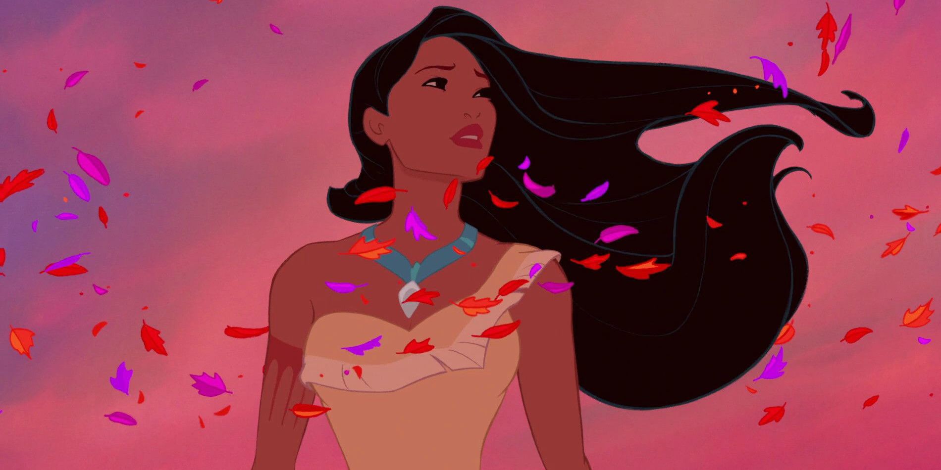 Pocahontas stands in the middle of red and purple leaves