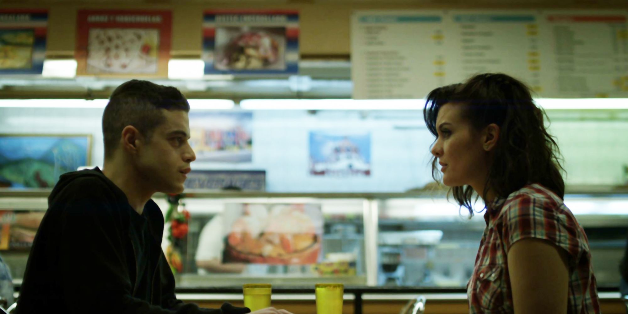 Elliot sitting across from his girlfriend in a diner in a scene from Mr. Robot.