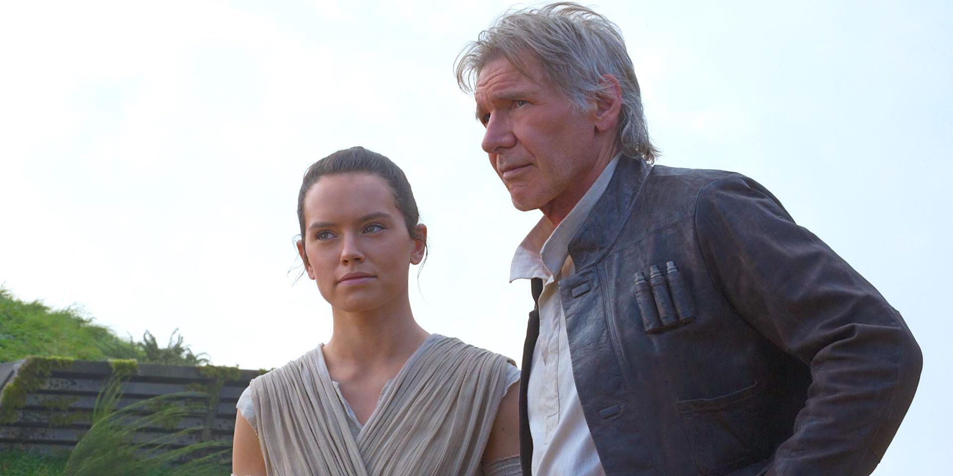 Rey and Han Solo standing by the Falcon in Star Wars The Force Awakens