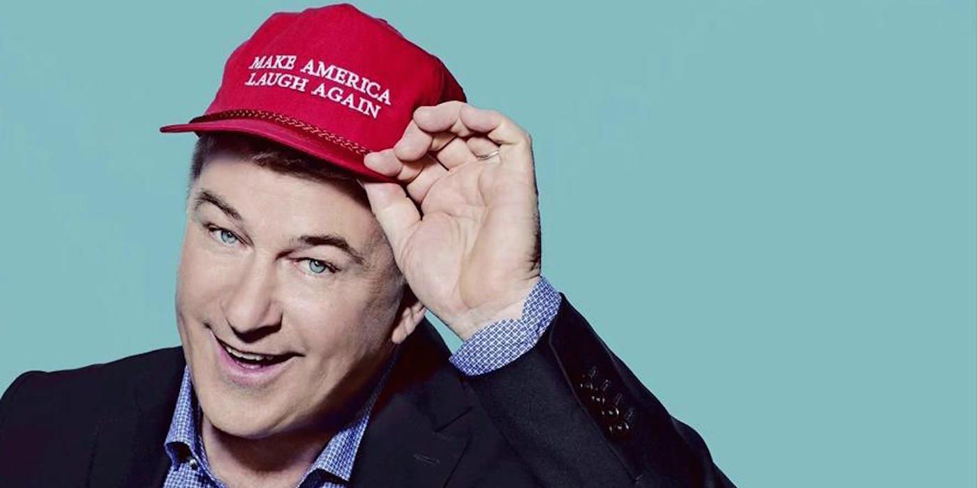 Alec Baldwin poses with a red hat from SNL