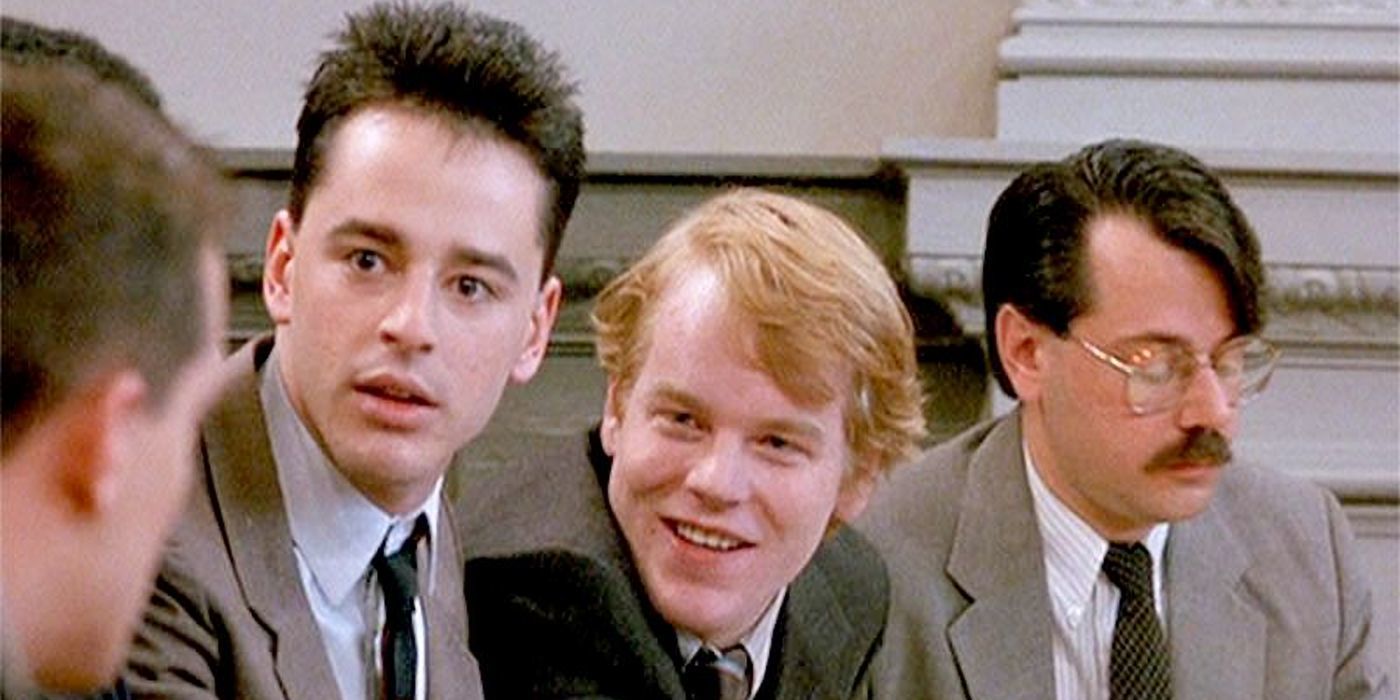 Philip Seymour Hoffman and two other men smiling in Law &amp; Order.