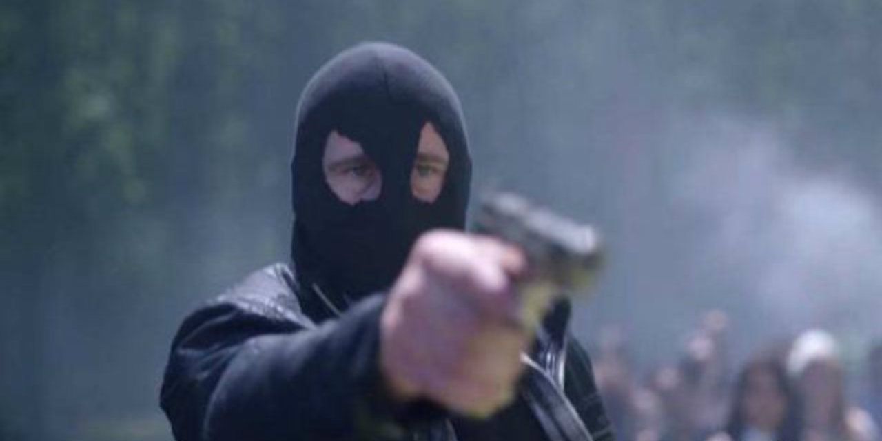 An image of the Black Hood holding a gun in Riverdale