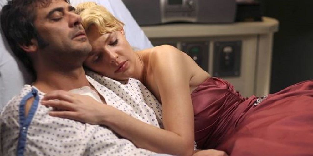 Denny and Izzie lying in bed together on Grey's Anatomy