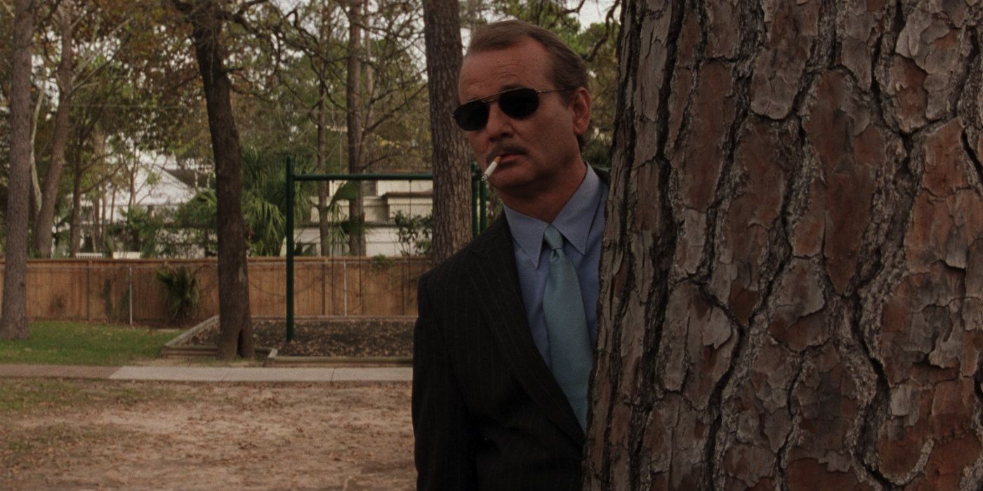 Bill Murray hiding behind a tree in Rushmore
