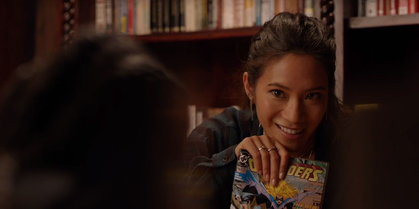 Grace holds up a comic book in Black Lightning