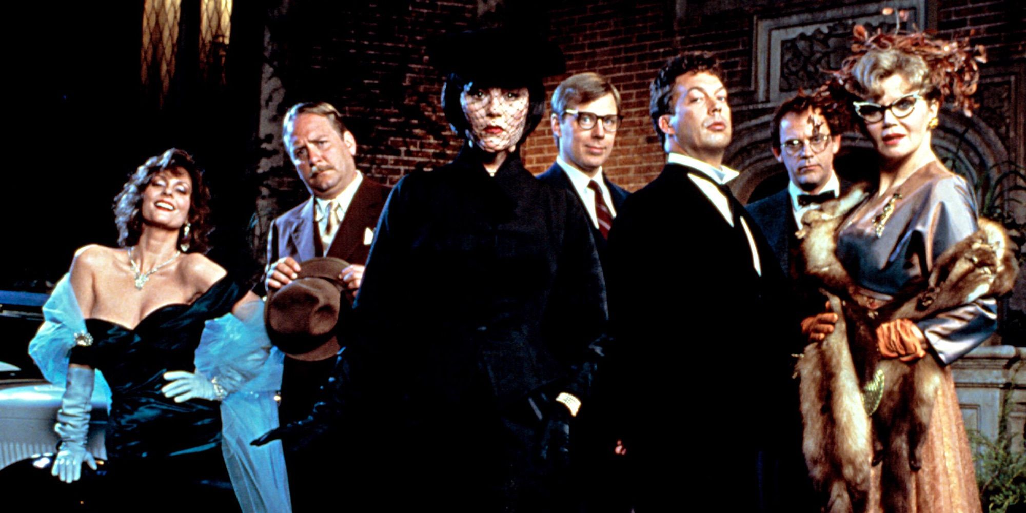 The cast of 1985's Clue posing outside the mansion