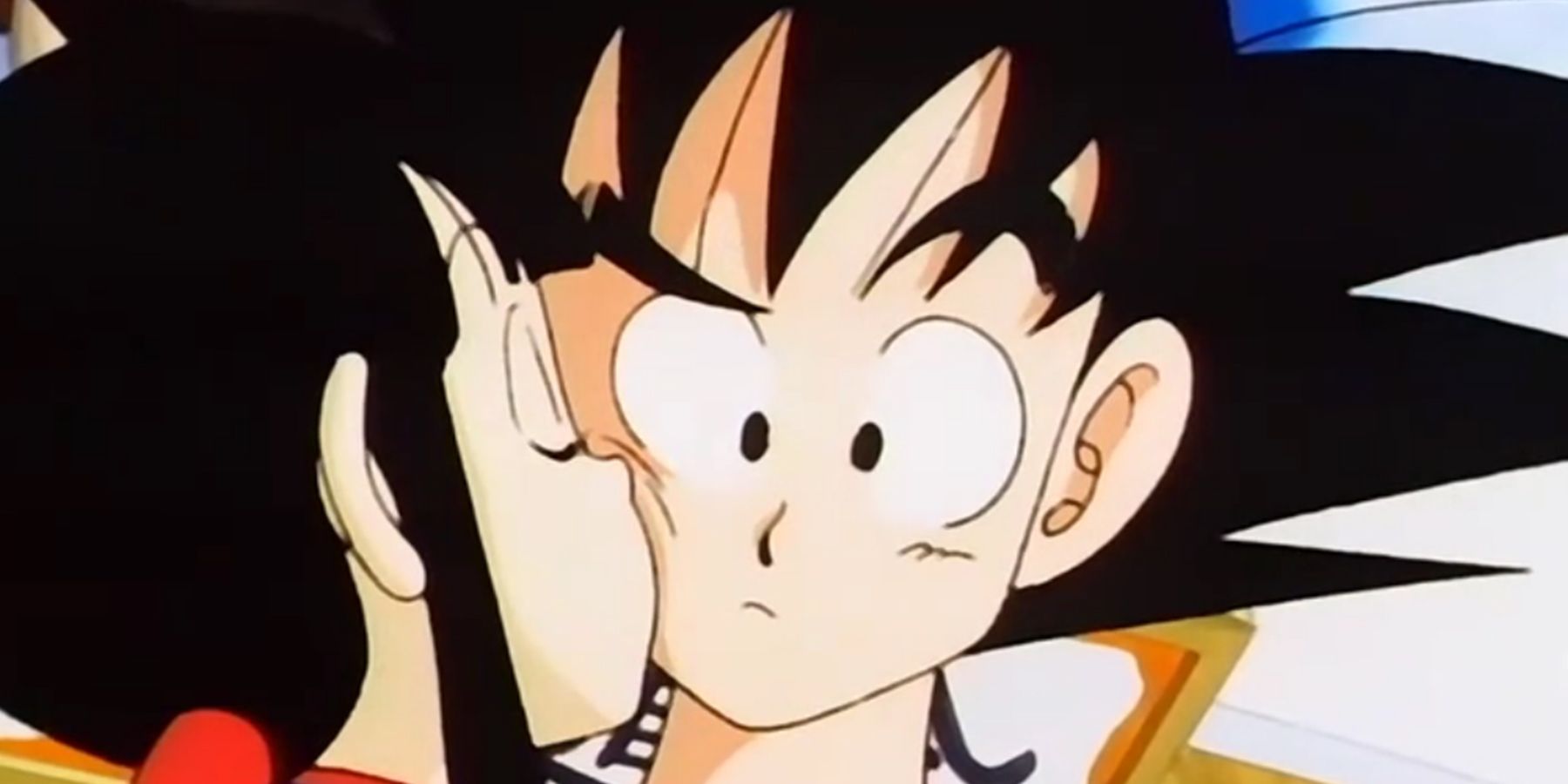 Chi-Chi kissing Goku on the cheek in Dragon Ball.