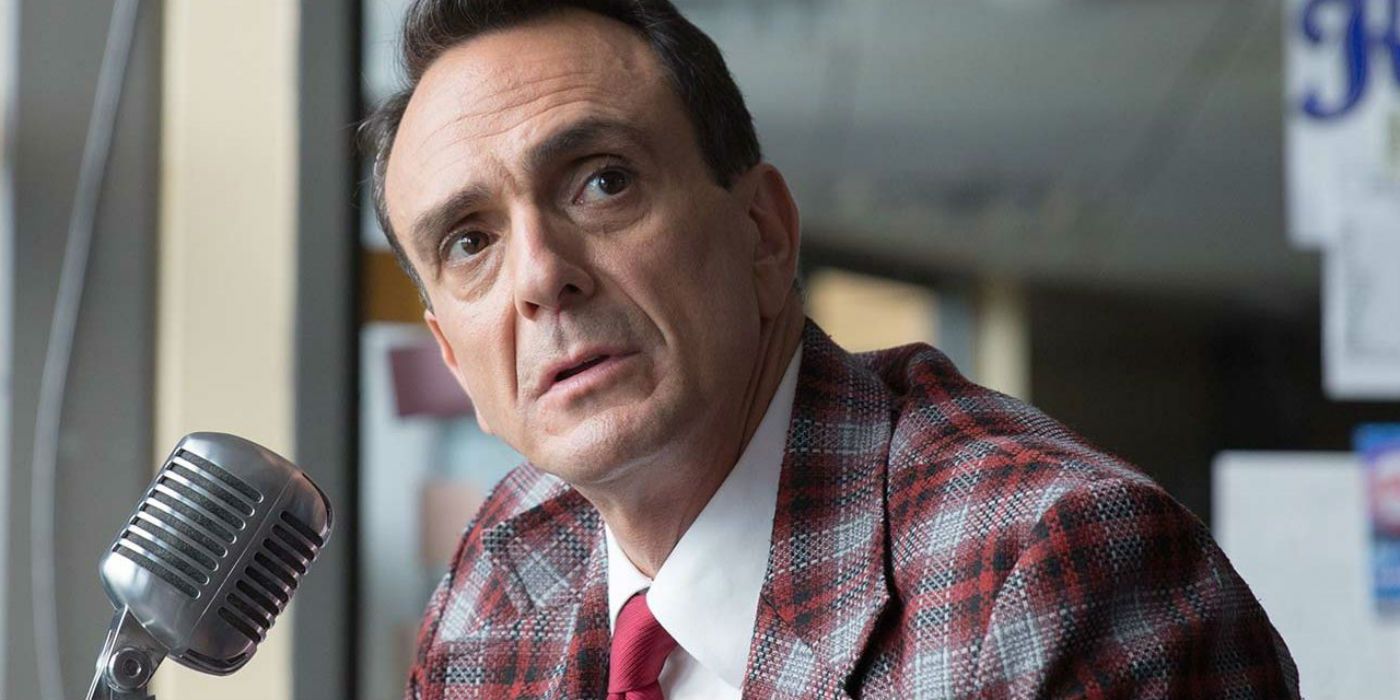 Jim Brockmire near a microphone, looking off into the distance, on Brockmire