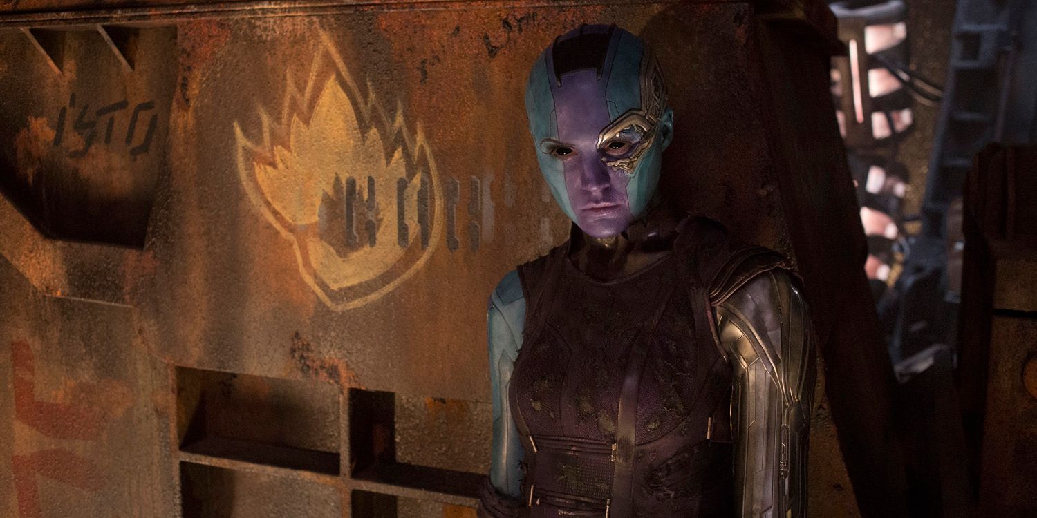 Nebula stands in front of the Guardians logo in the MCU