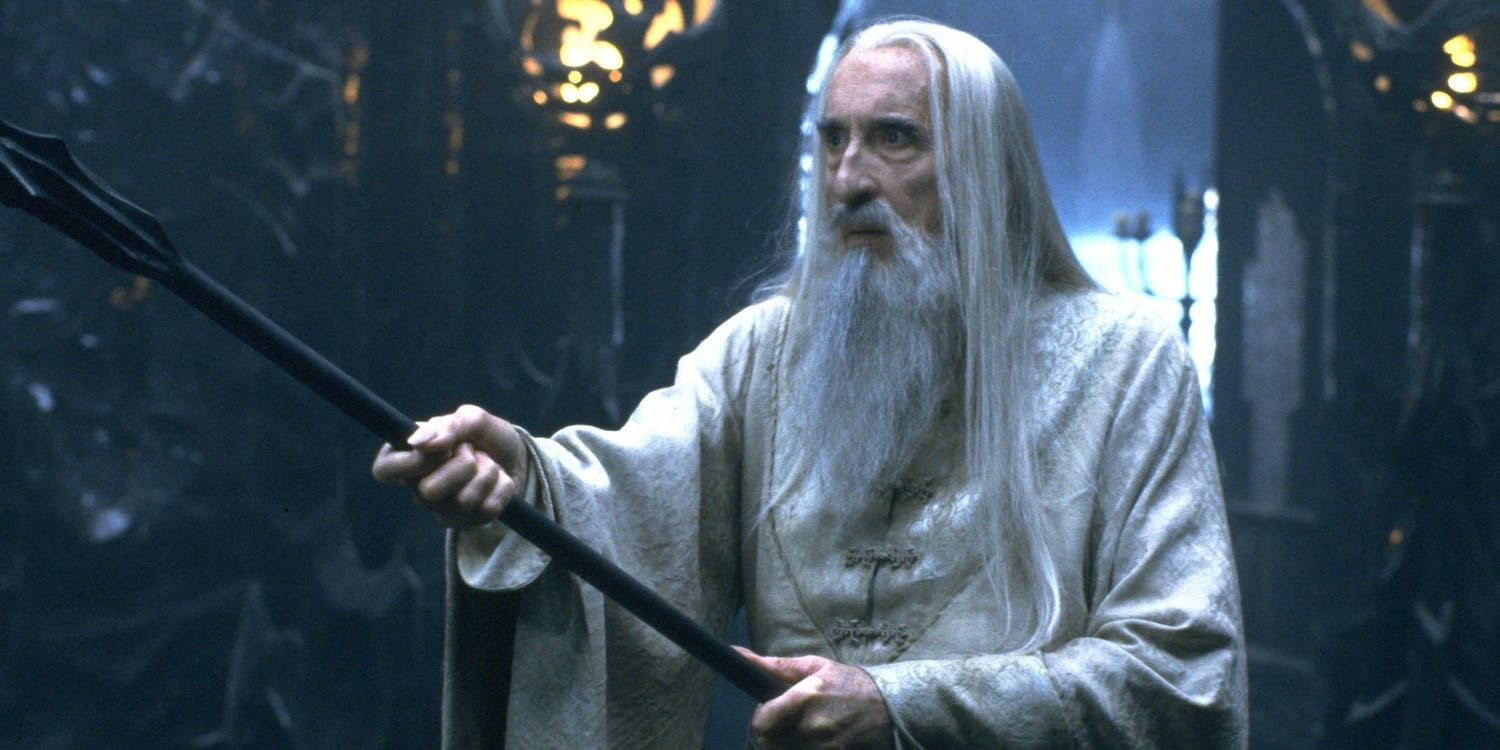 Christopher Lee holding a staff as Saruman in Lord of the Rings