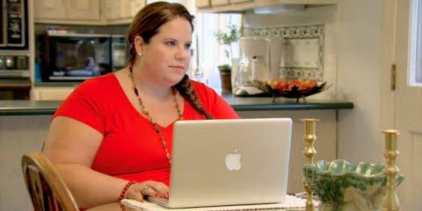 Whitney Way Thore computer wearing red shirt