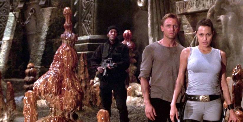 Lara Croft and Alex West held at gun point in Lara Croft: Tomb Raider