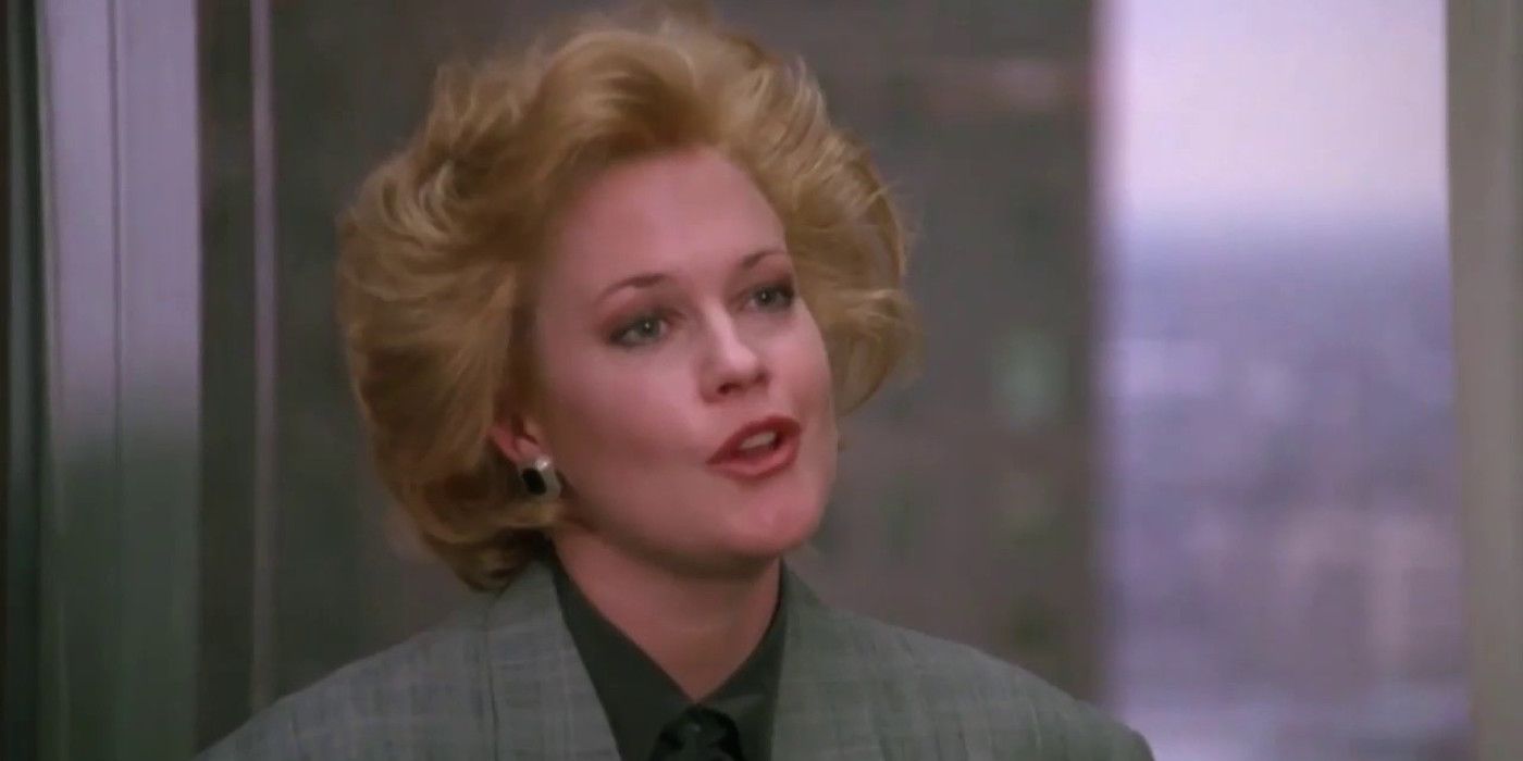 Tess (Melanie Griffith) looking annoyed in Working Girl.
