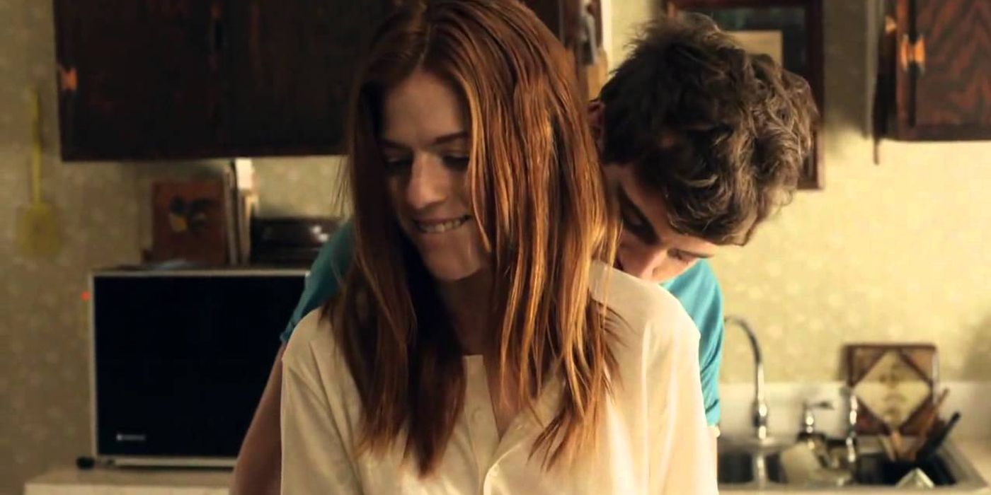 Rose Leslie and Harry Treadaway embracing in the kitchen in Honeymoon