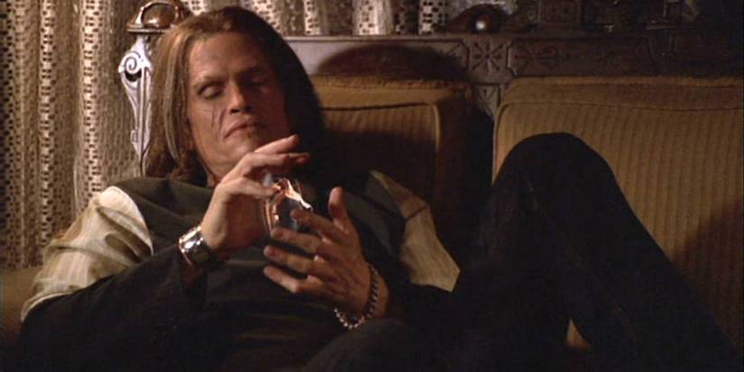 Rack (Jeff Kober) holding a magic object in Buffy the Vampire Slayer