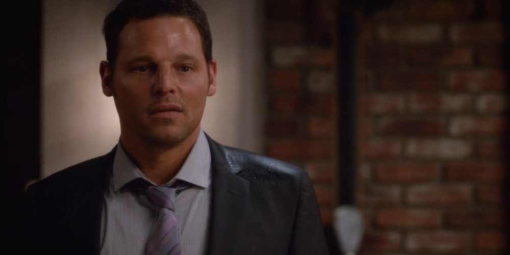 Alex Karev wearing a suit and looking confused in Grey's Anatomy