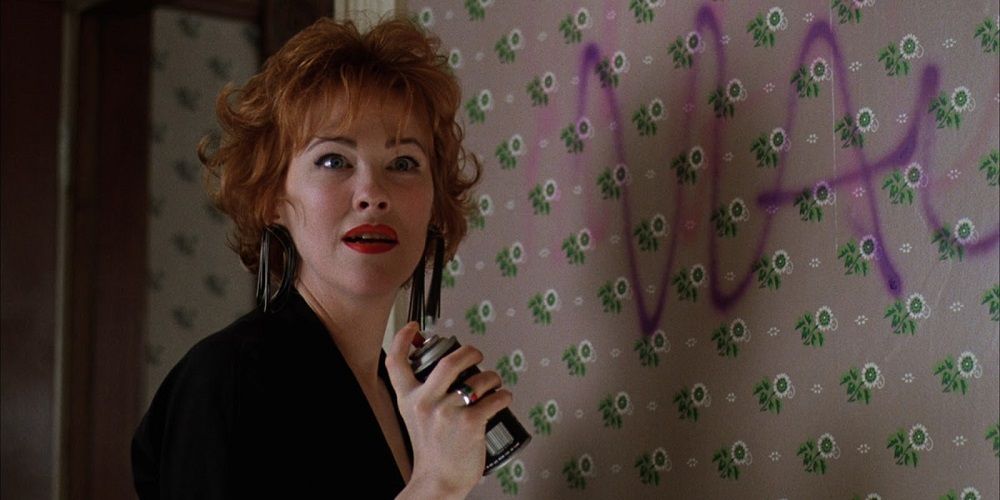 Delia Spray-painting on a wall in Beetlejuice