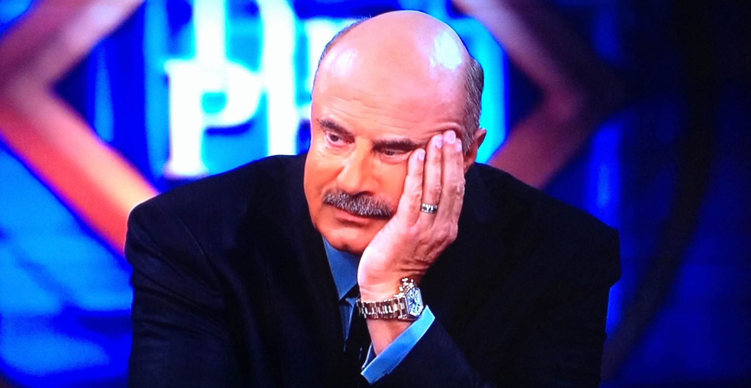 Dr Phil holding his head
