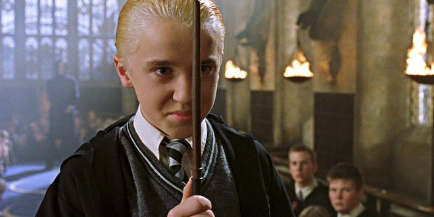 Draco Malfoy holding a wand in dueling club in Chamber of Secrets