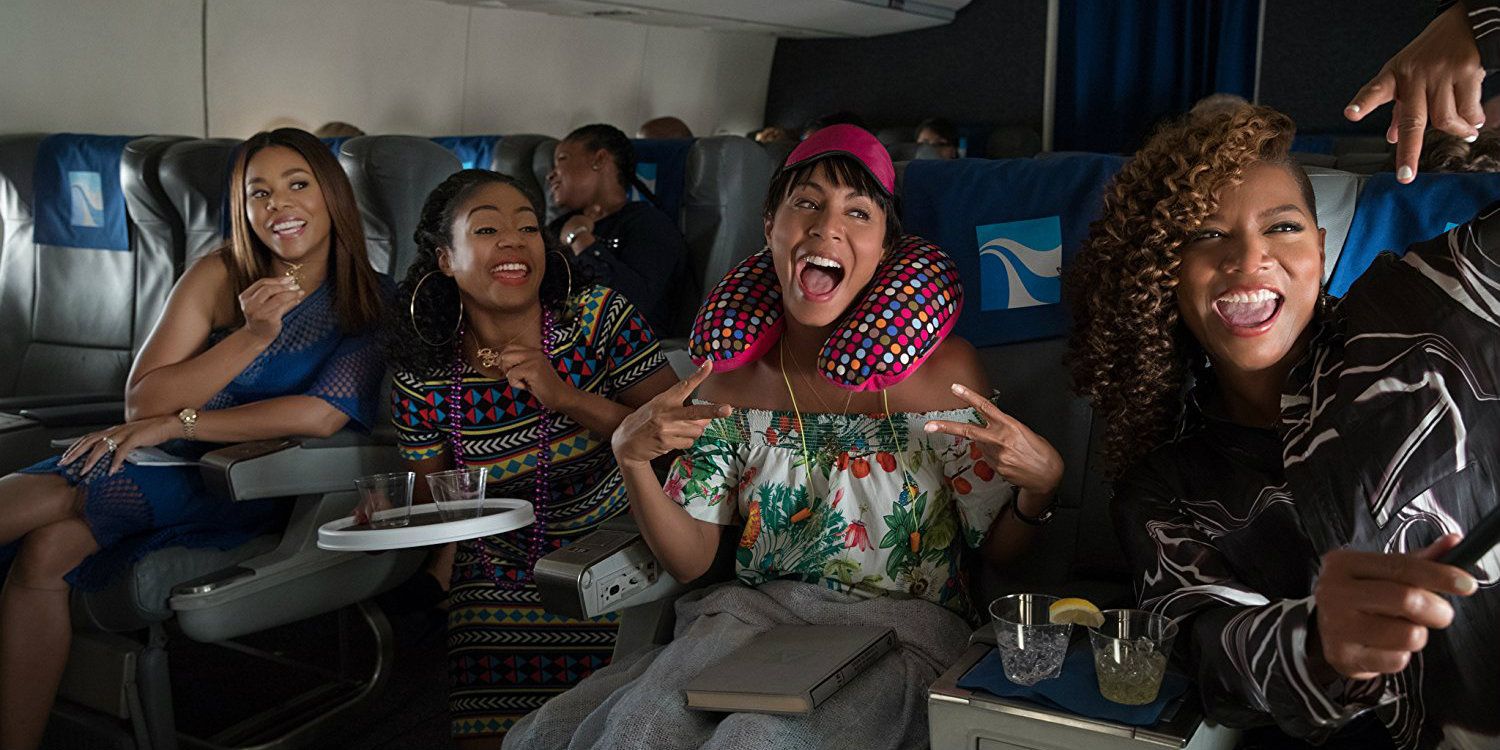 Regina Hall, Tiffany Hadish, Queen Latifah, Jada Pinkett Smith on a plane in Girl's Trip