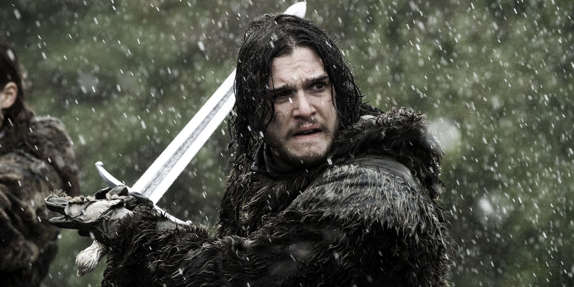 Jon Snow holding Longclaw under the rain in Game of Thrones