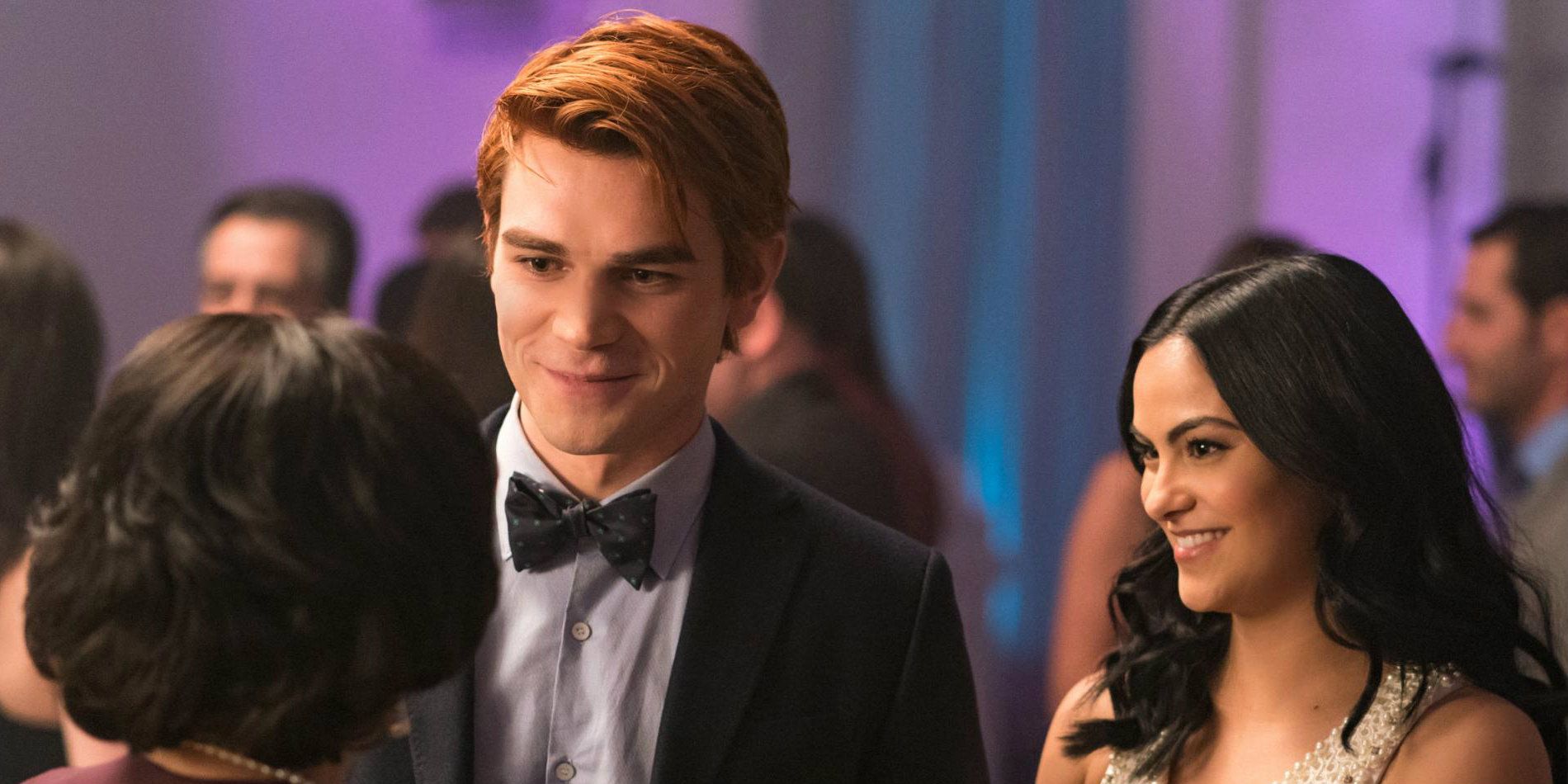 Archie and Veronica smile during prom in Riverdale.