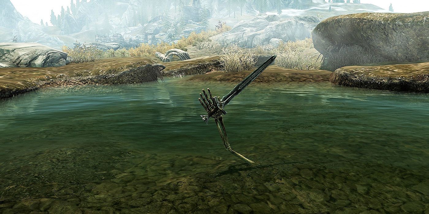 A skeletal hand holding a sword in Skyrim