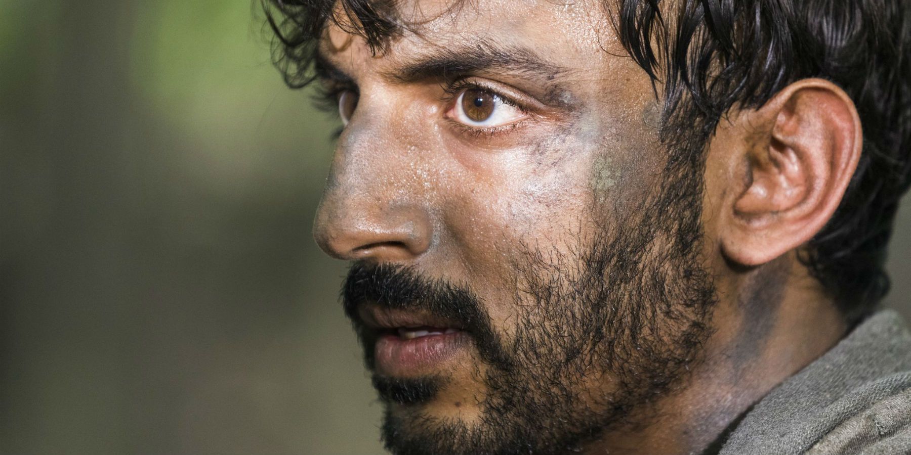 A close-up of Siddiq from The Walking Dead.