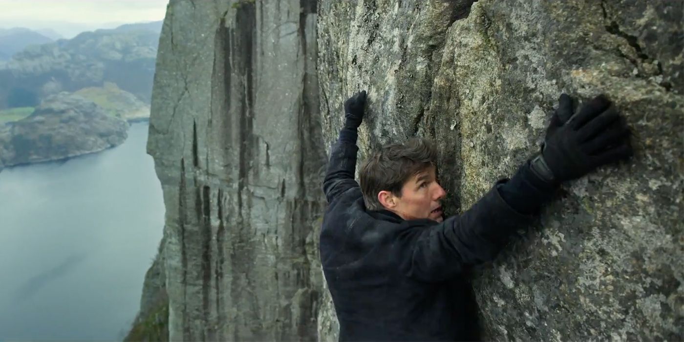 Tom Cruise hanging from a cliff in Mission Impossible Fallout
