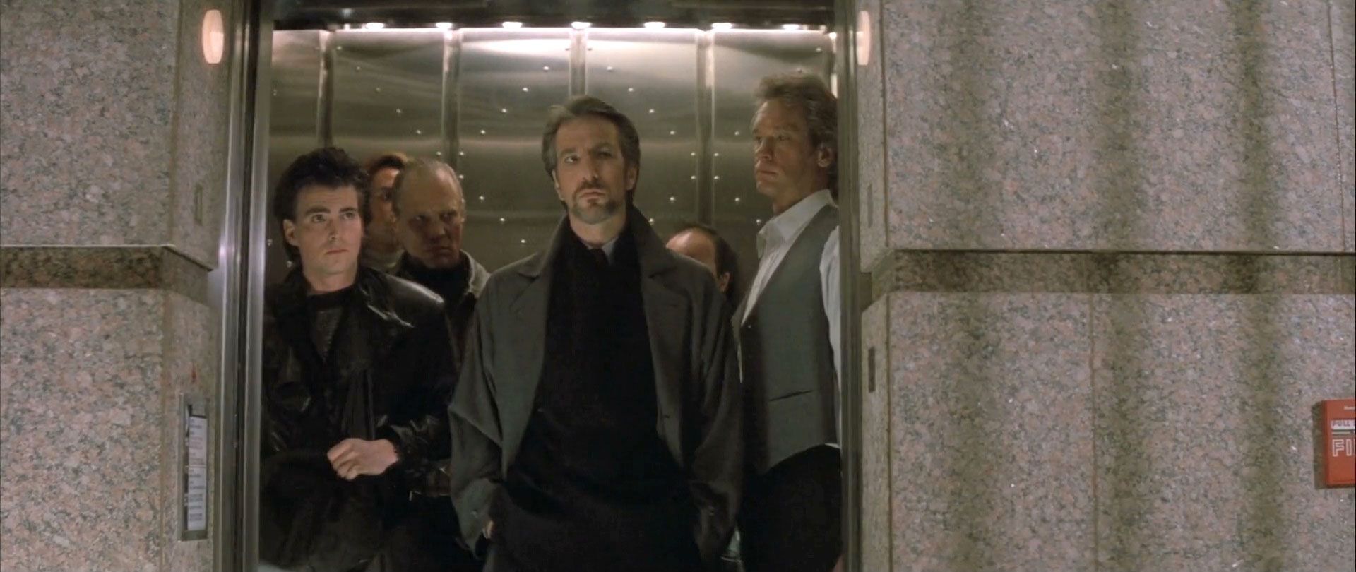 Hans Gruber and the villains arriving on the elevator in Die Hard