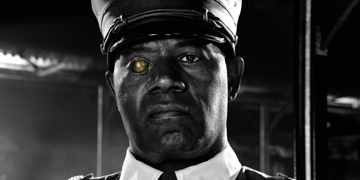 Manute (Dennis Haysbert) as he appears in Sin City: A Dame To Kill For